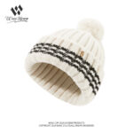 custom soft wool blend vertical rib skull cap, fold cuff white stripe jacquard, fluffy top pom pom, metal letter badge winter beanie