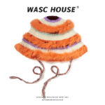 custom round top multi tone hand crochet knitted bucket hat, creamlilacsky blue horizontal color block stripe, three layers orange long pile fur fringe, mixed confetti yarn chin tie strings y2k winter party hat