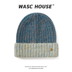 custom teal blue mixed marled wool blend thick rib skull cap, contrast light cream heather fold cuff, small engraved vintage gold snap button minimal outdoor winter hat